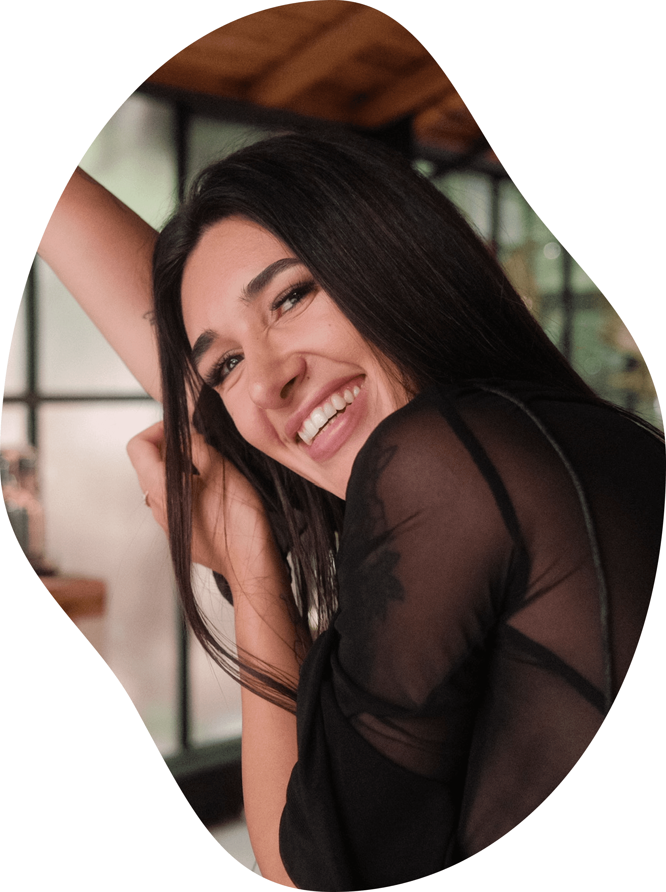 Jo Guerreiro smiling, certified Somatic Experiencing Practitioner with extensive training in trauma-informed somatic therapy